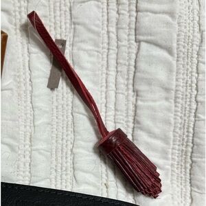 Portland Leather Pom tassel Sangria (I think)